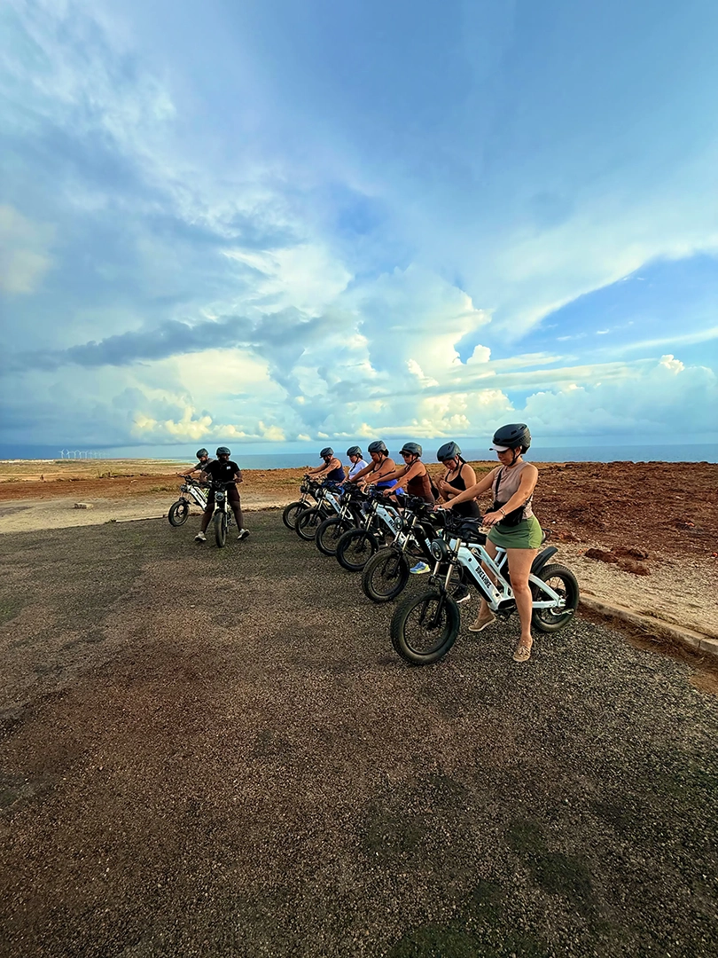 Group of riders lined up on E-bikes in Aruba
