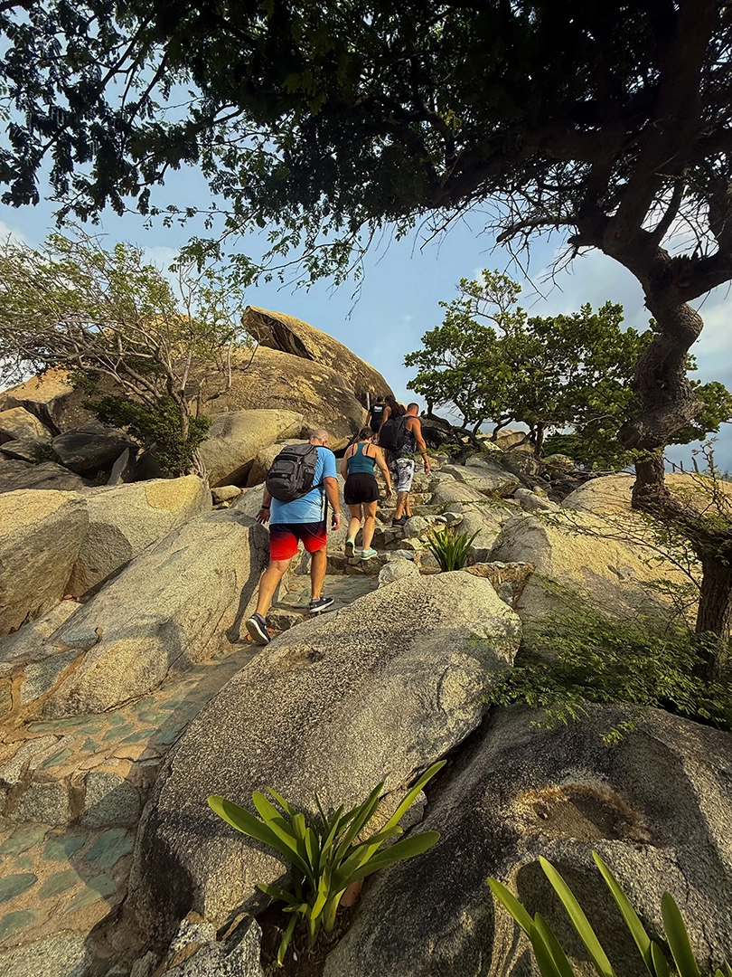 Hikers climbing Arikok trails