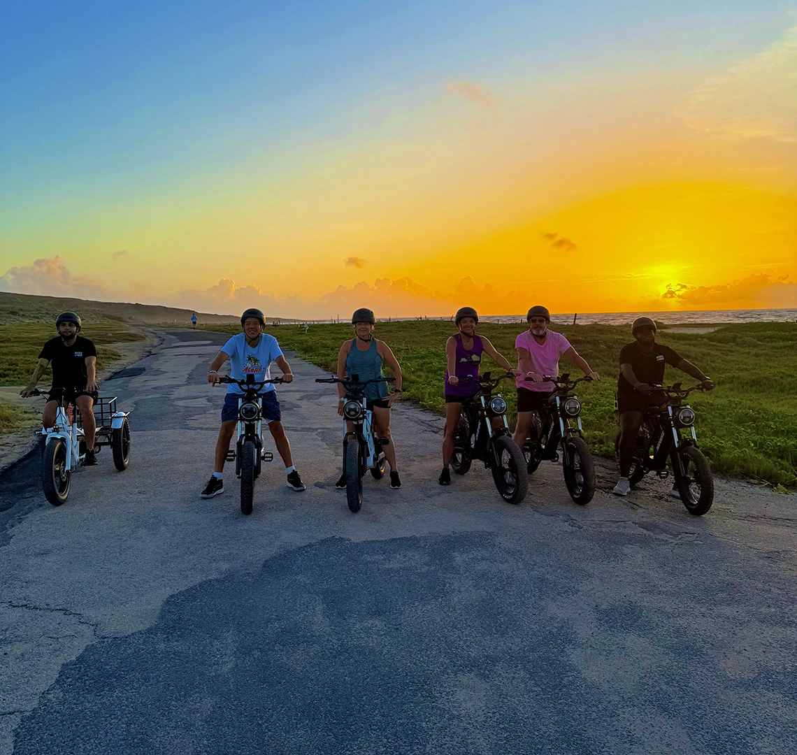 Riders at sunrise on coastal road