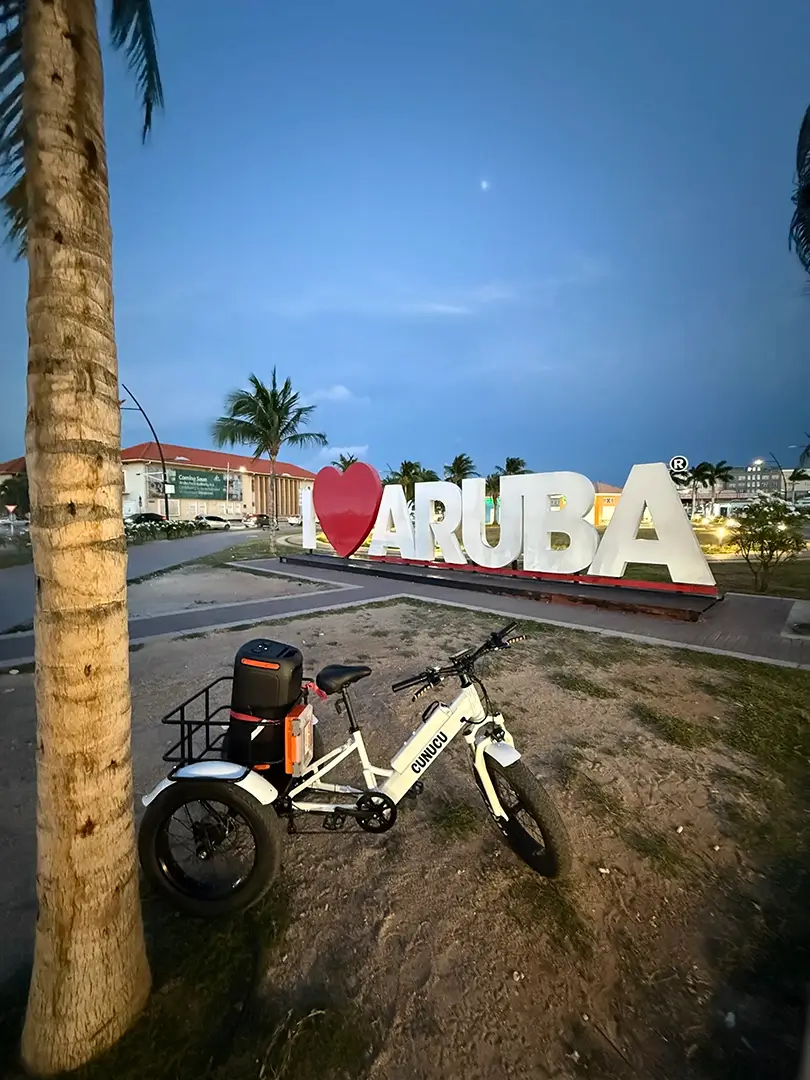 E-bike at I Love Aruba sign