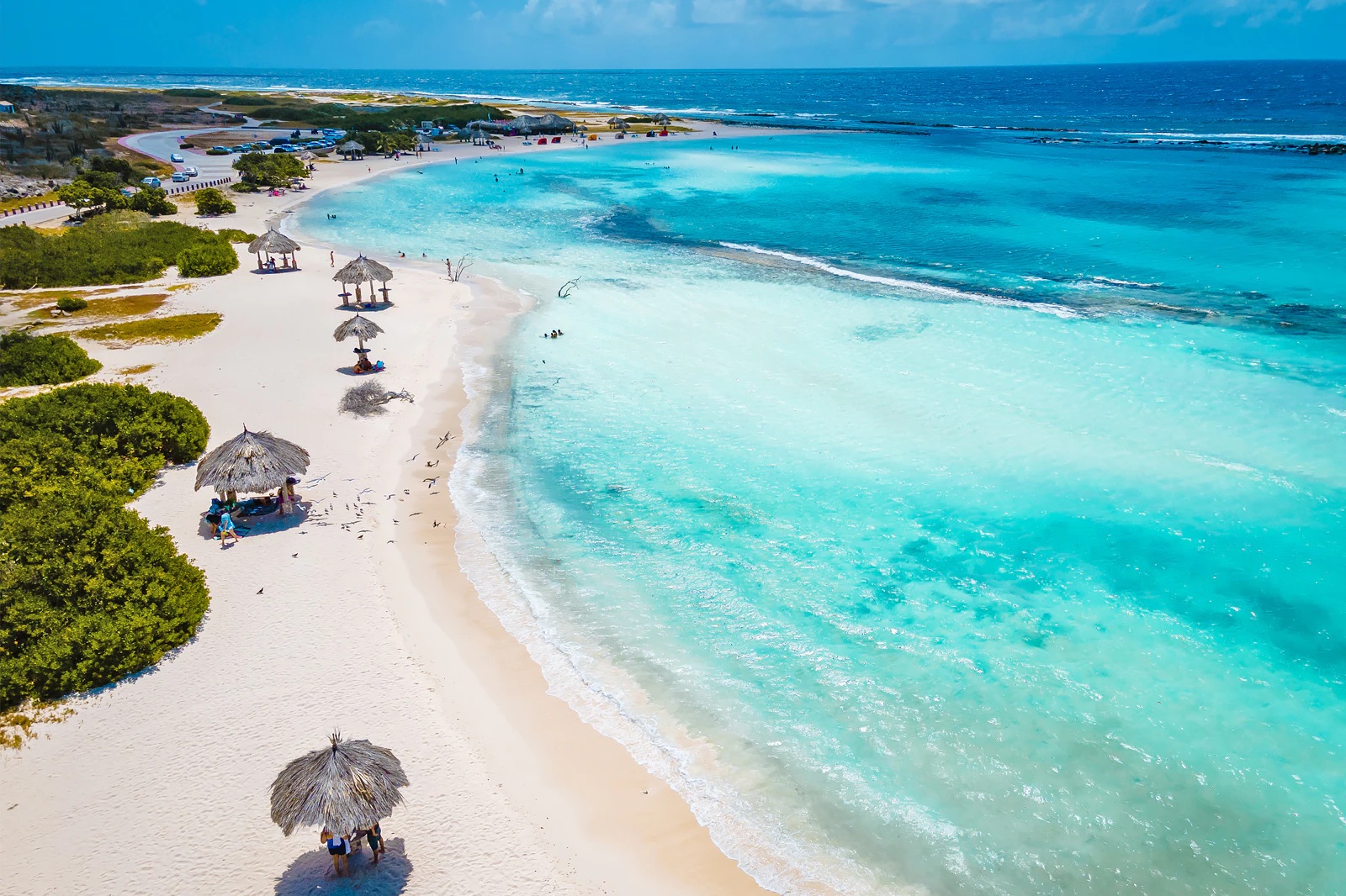 Aerial view of Baby Beach's white sand and turquoise lagoon